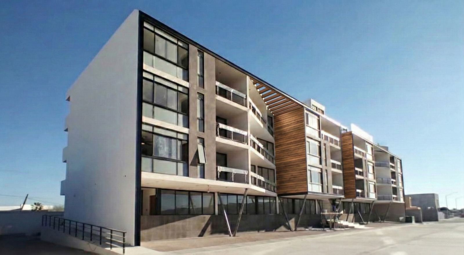Torre de departamentos terminada en La Paz, con volúmenes de madera y balcones de cristal